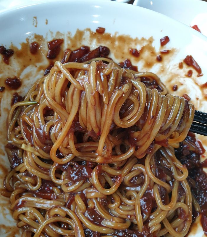 a close-up view of jajangmyeon noodles